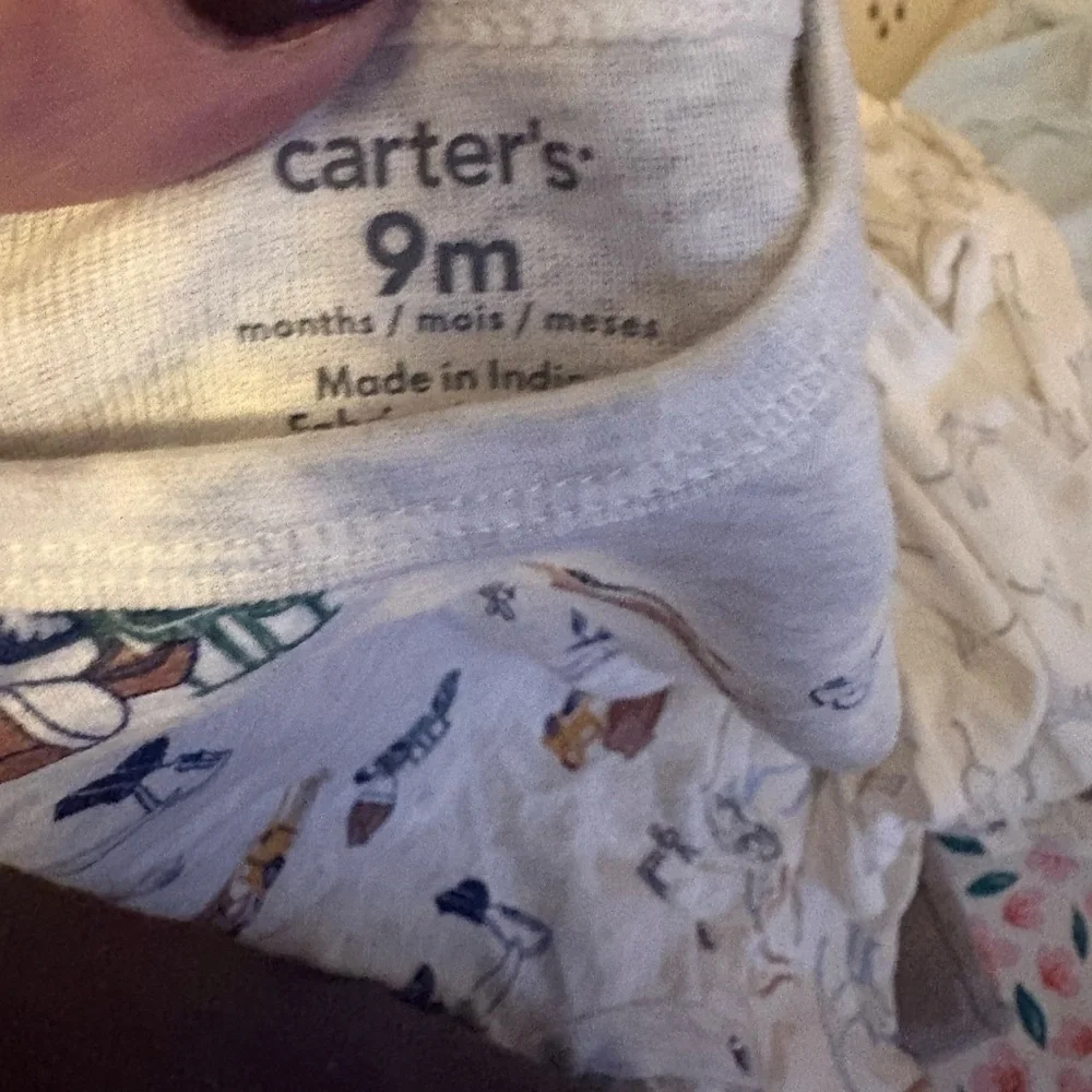 Carter's Cream Bodysuit with Animal Design.  5 size 9 months onesies for $15